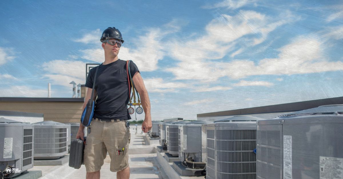 HVAC Technician working on a roof with sunny sky behind him