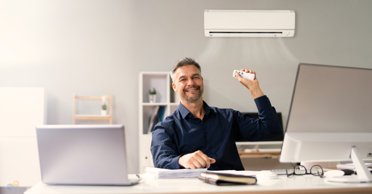 male enjoying his office after finding our early signs his air conditioner needed repair and got it fixed by local hvac company